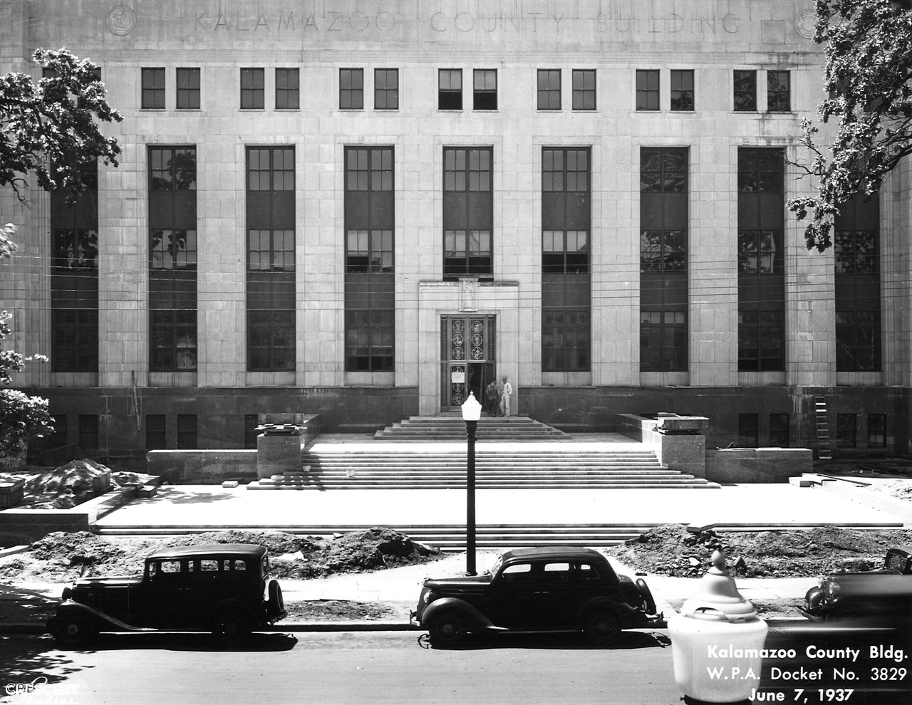 Kalamazoo County Building under construction in 1937, photographed during New Deal public works era—historical context for local housing discrimination policies.