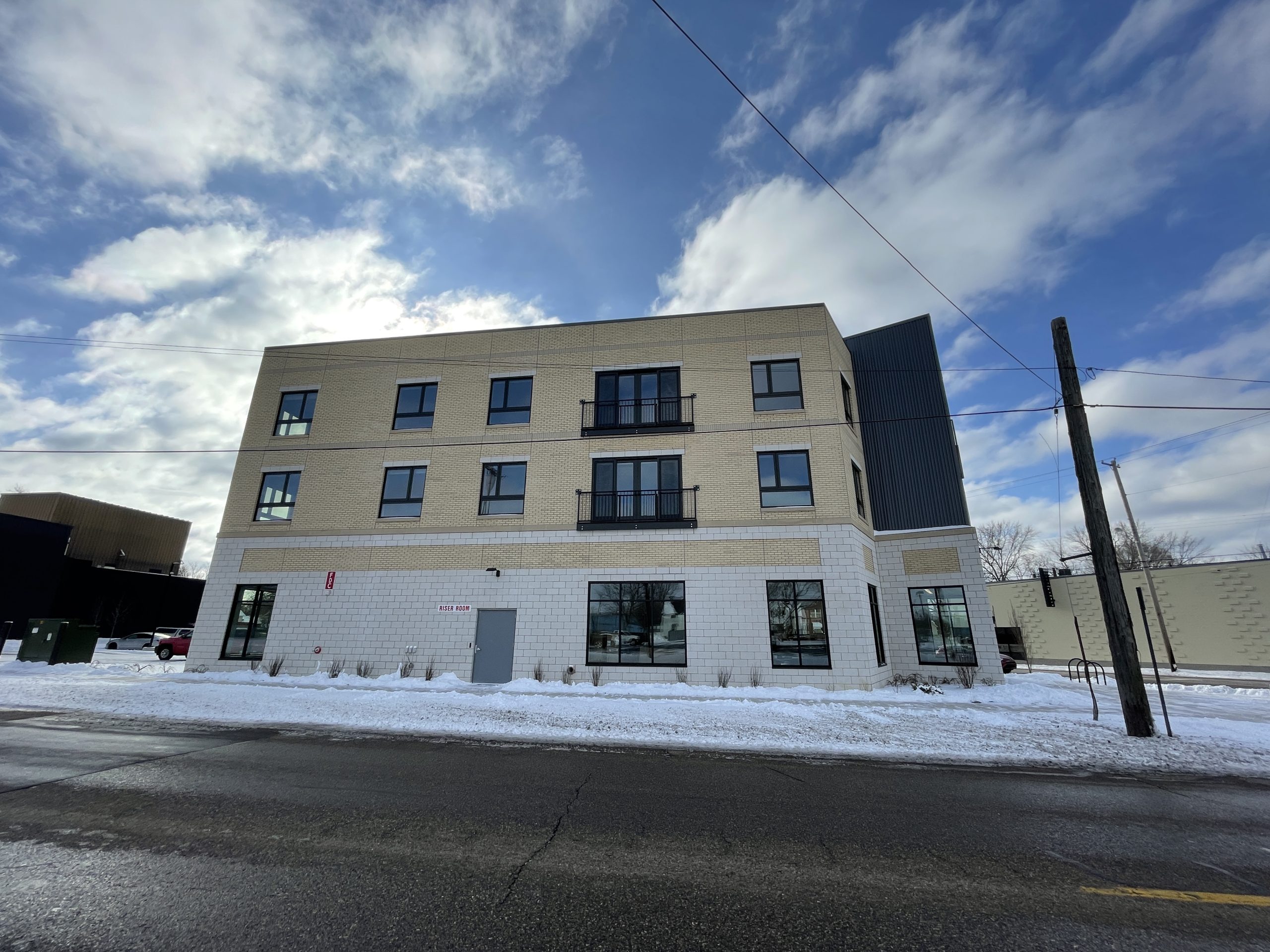 Exterior view of The Creamery Apartments in Kalamazoo, Michigan, winter 2024 (photo from U.S. Green Building Council project page).