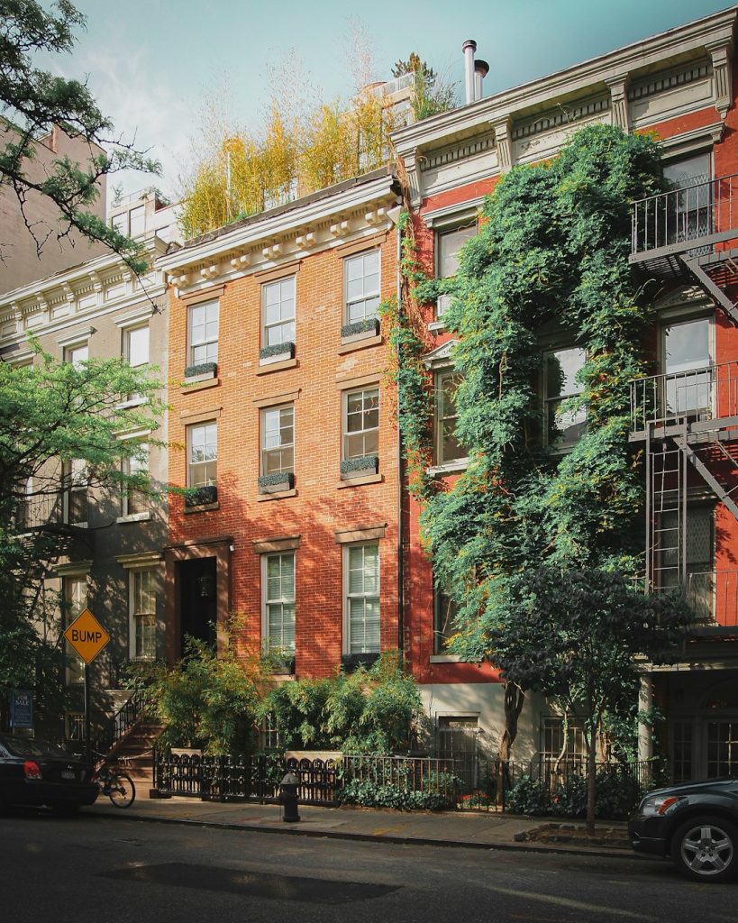 Apartment buildings on a residential street, representing everyday housing affected by fair housing and discrimination issues.