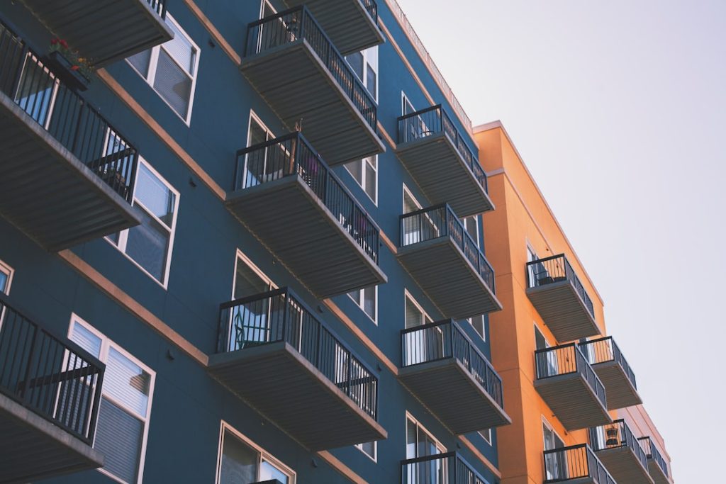 Exterior of a multi-unit apartment building with balconies, representing rental housing where HUD discrimination complaints may arise.