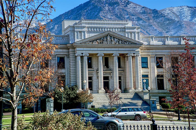 Exterior of a neoclassical courthouse building, representing formal legal institutions.