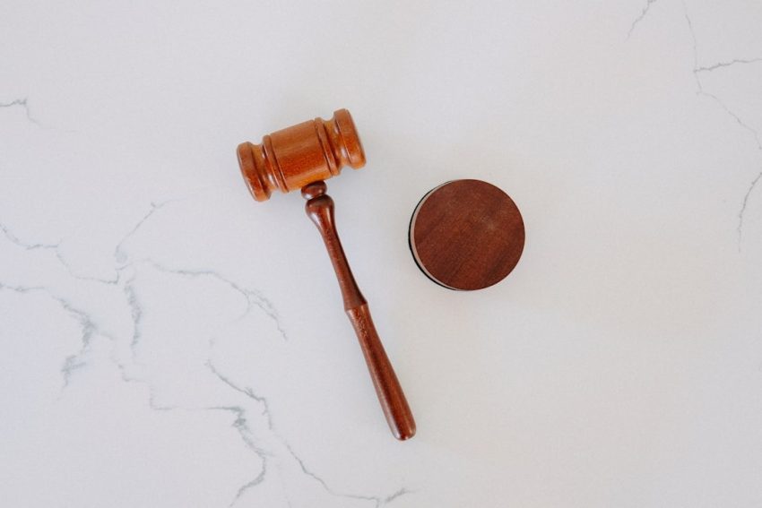Wooden gavel on marble surface representing judicial disqualification and court decision-making